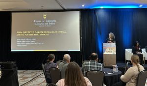 Dr. Mira Becevic presenting on the work of C-TRaP